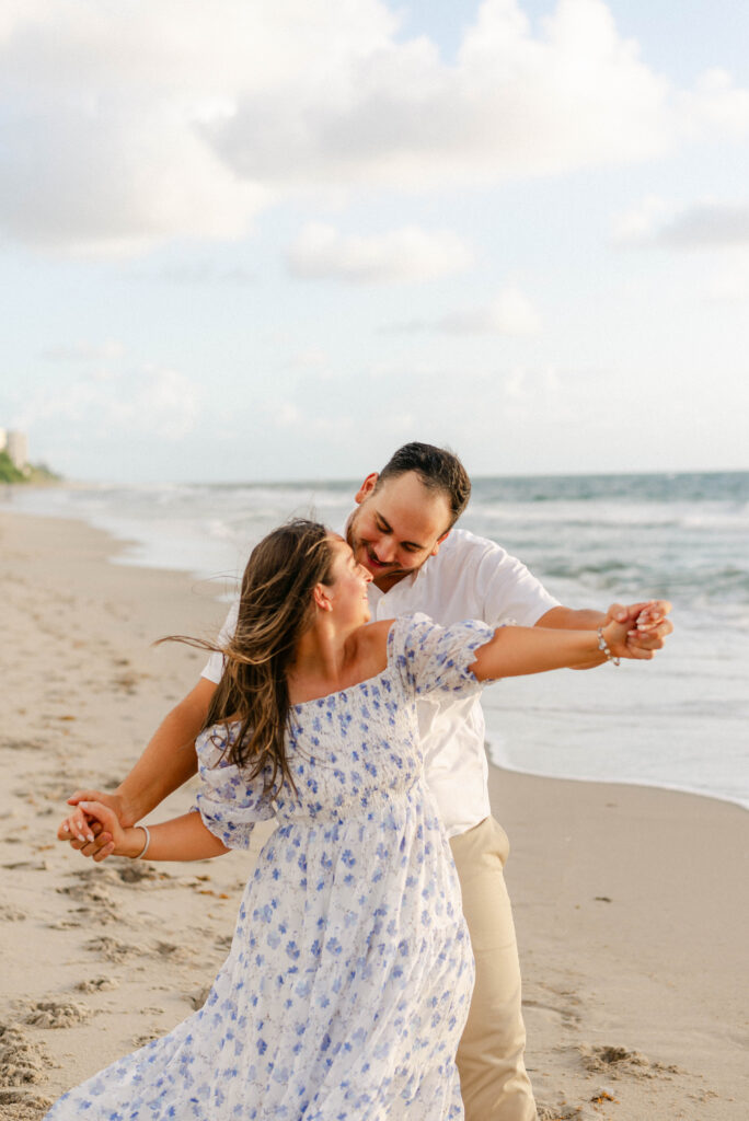 Engagement session on the beach in Palm Beach, Florida. Couple smiling together