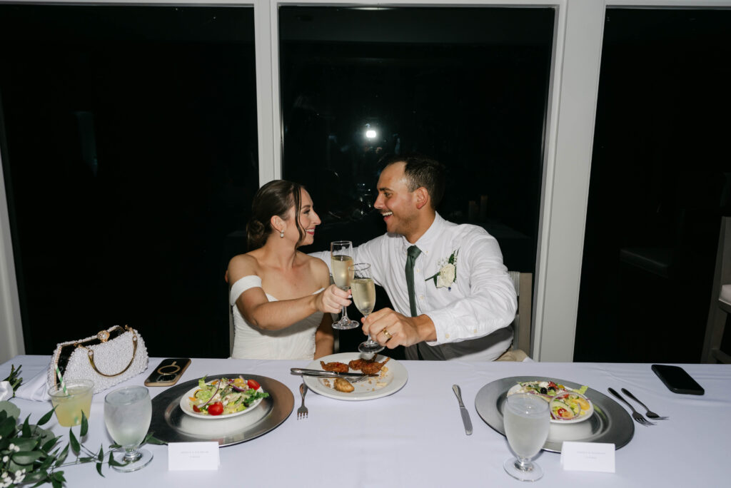 bride and groom saying cheers during the reception in color