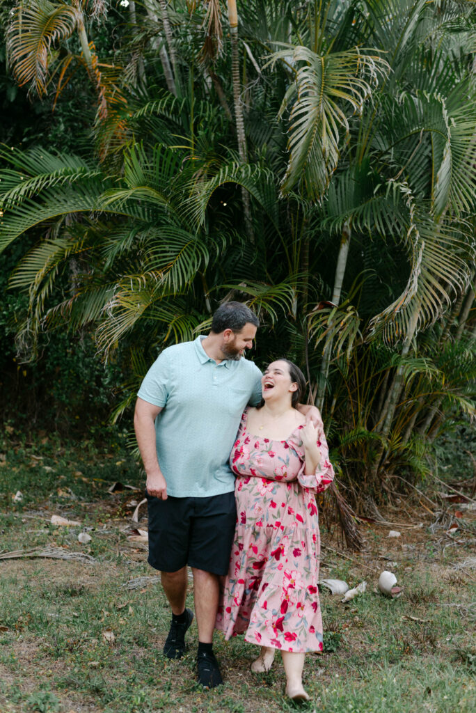 Christine and Patrick laughing together moments after getting engaged