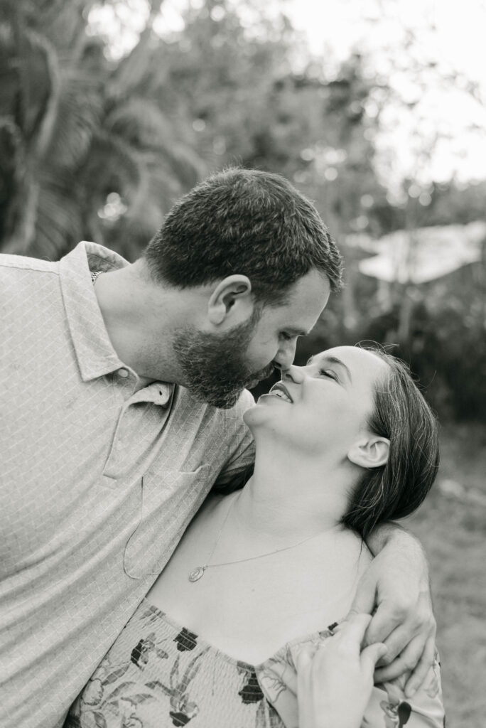 Couple going in for a kiss after saying yes in West Palm Beach