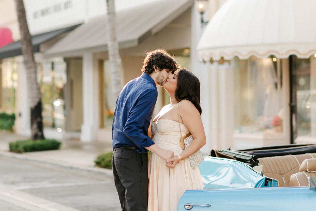 Kenia looking over shoulder with scarf blowing in breeze
