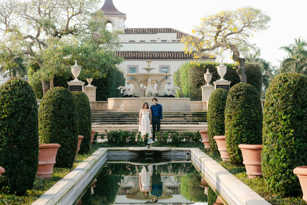 couple looks at camera in this wide shot at palm beach memorial park