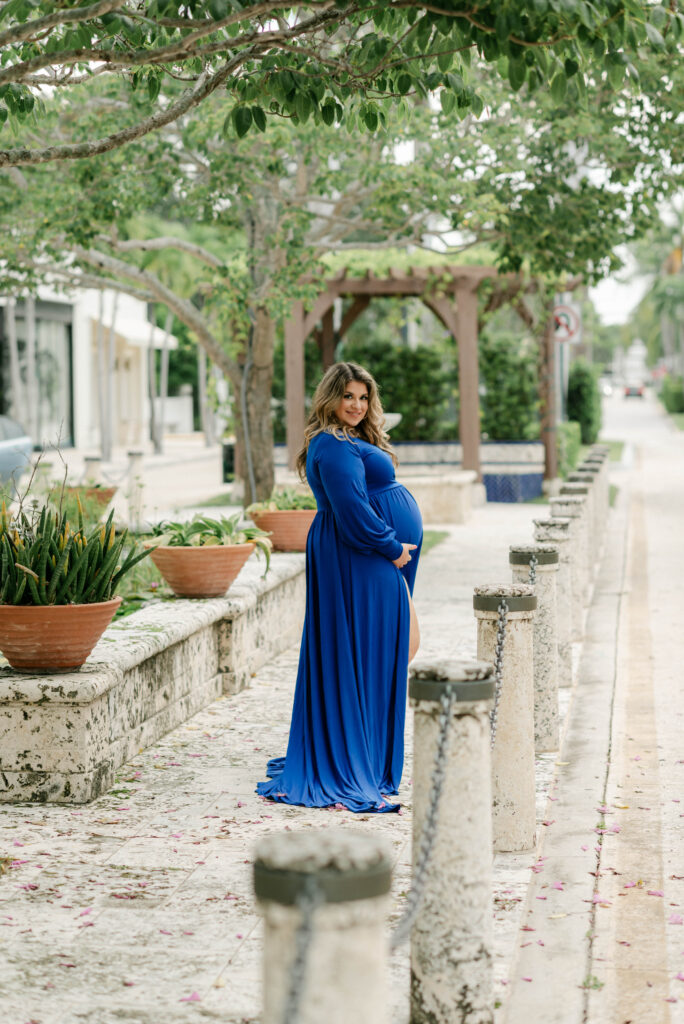 Flowing maternity dress captured in motion on Palm Beach Island