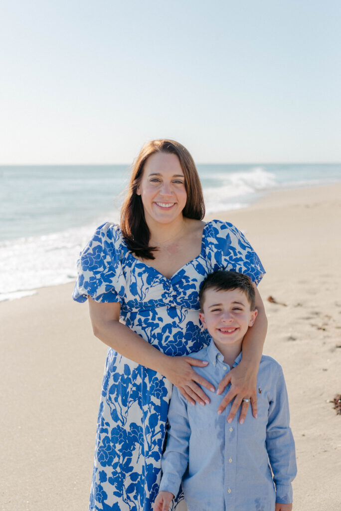 Mother and son on the Palm Beach shoreline during family session