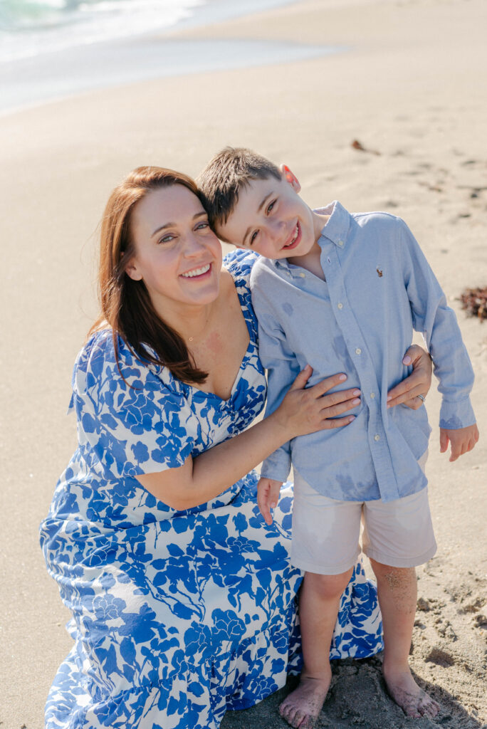 Palm Beach family photos in harsh sunlight with soft pastel outfits
