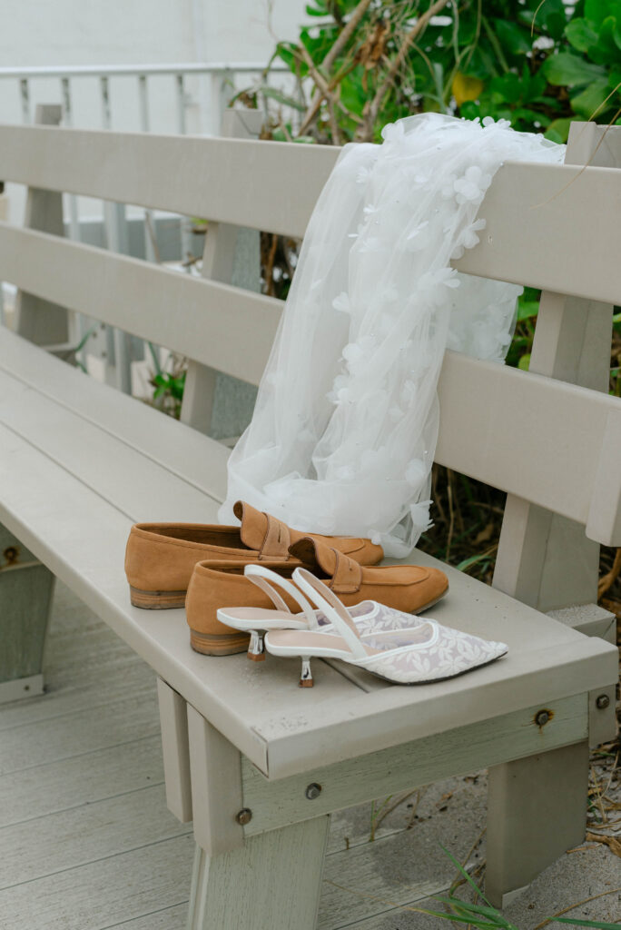 bride and groom's shoes left by the beach entrance