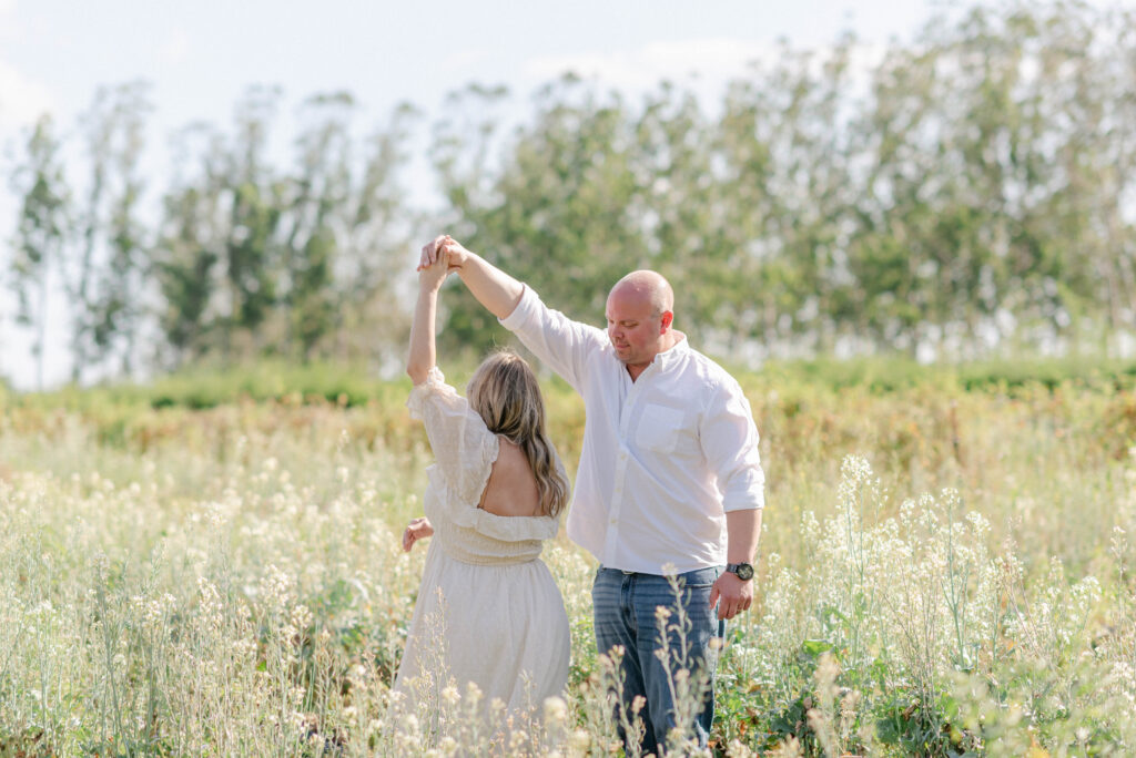 Golden hour light shining behind couple during maternity session in South Florida