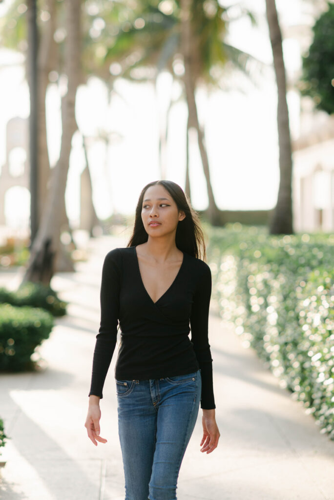 Modern headshot of model walking toward camera in Palm Beach Florida