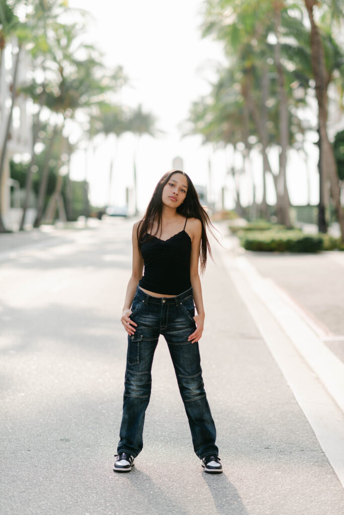 Personal branding photo of model standing confidently in the street