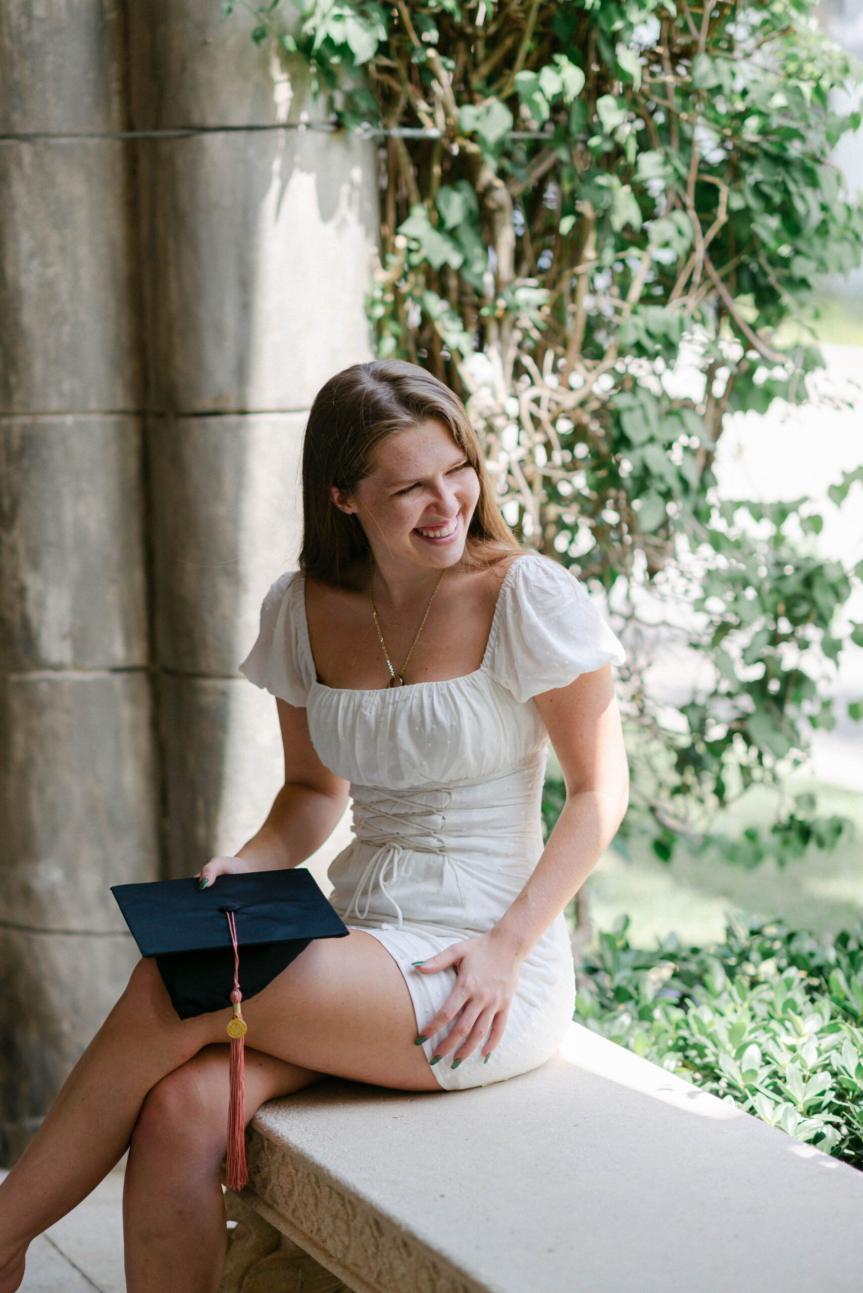 Graduation photo session on Worth Avenue with white dress and soft lighting