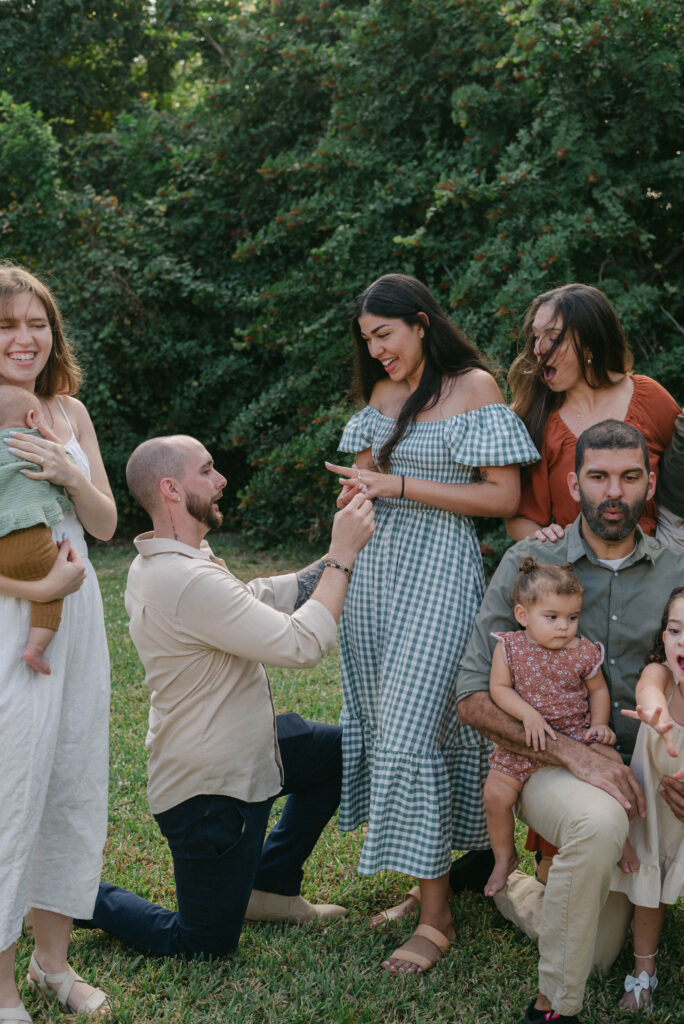 Children watching proposal moment during family photography session in Ocala