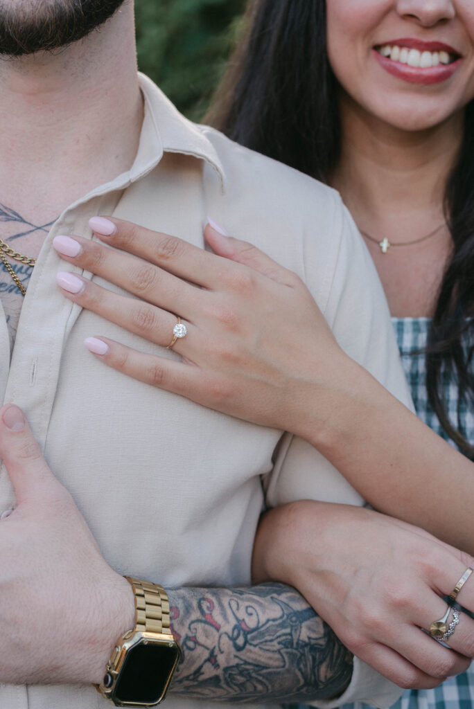 Joyful engagement moment surrounded by family in Ocala backyard setting