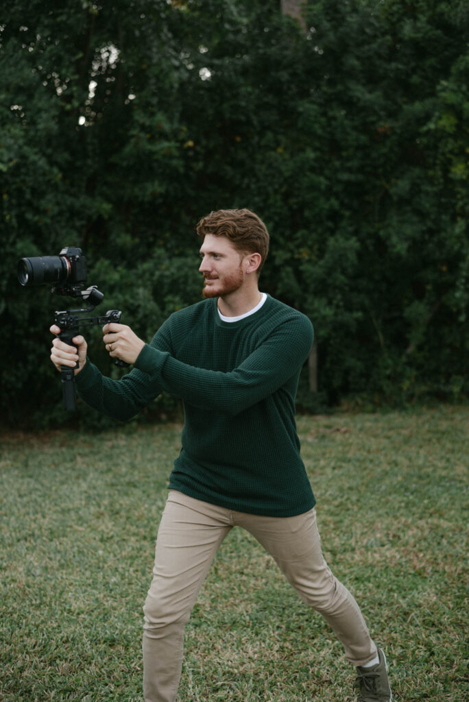 Kevin posing with videography gear, Ocala family and wedding photography professionals