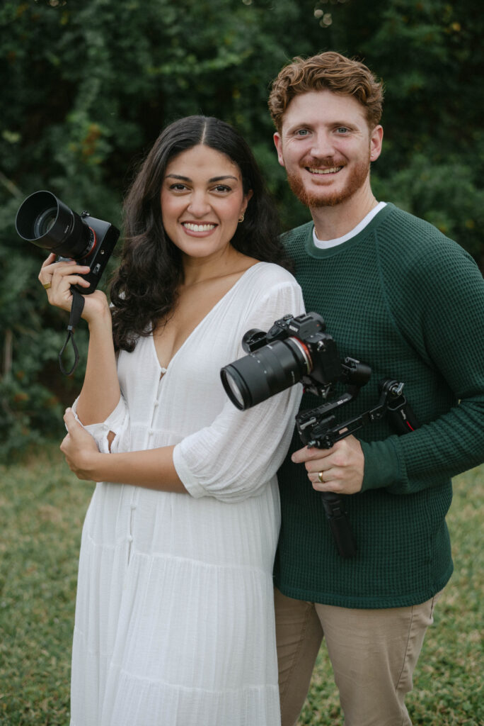 Faithful Media Co team photo: Amy and Kevin with cameras, ready for Ocala wedding and family photography sessions
