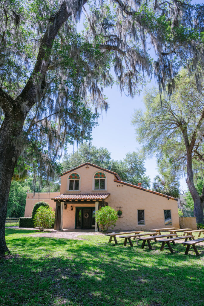 Eterna Estate outdoor ceremony space in Bushnell Florida with elegant wedding arch and natural greenery, photographed by Florida wedding photographer