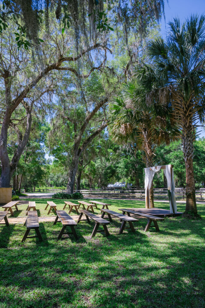 Ceremony aisle setup at Eterna Estate in Bushnell Florida with white chairs and romantic wedding decor